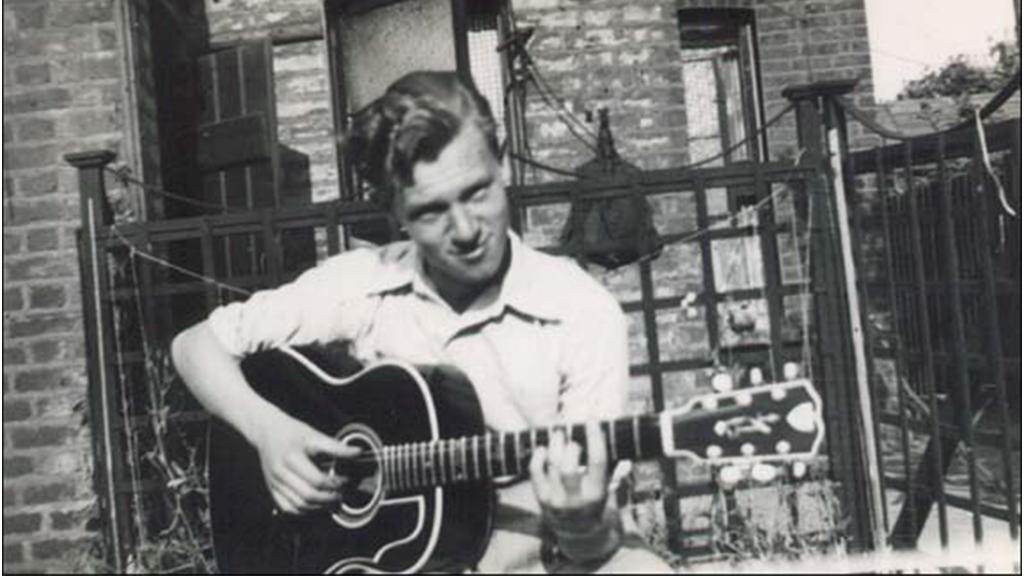 A photo of a young Bert Weedon playing an acoustic guitar
